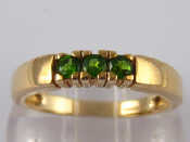 Appraisal: A carat gold three stone diopside ring size N gms