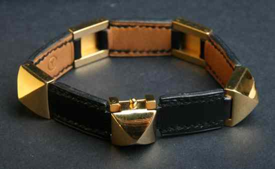 Appraisal: HERM S BLACK LEATHER AND GOLD PLATED MEDOR BRACELET Signed