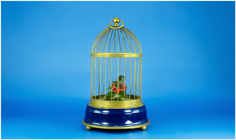 Appraisal: Automaton Singing Bird in a Brass Cage Clockwork movement 's