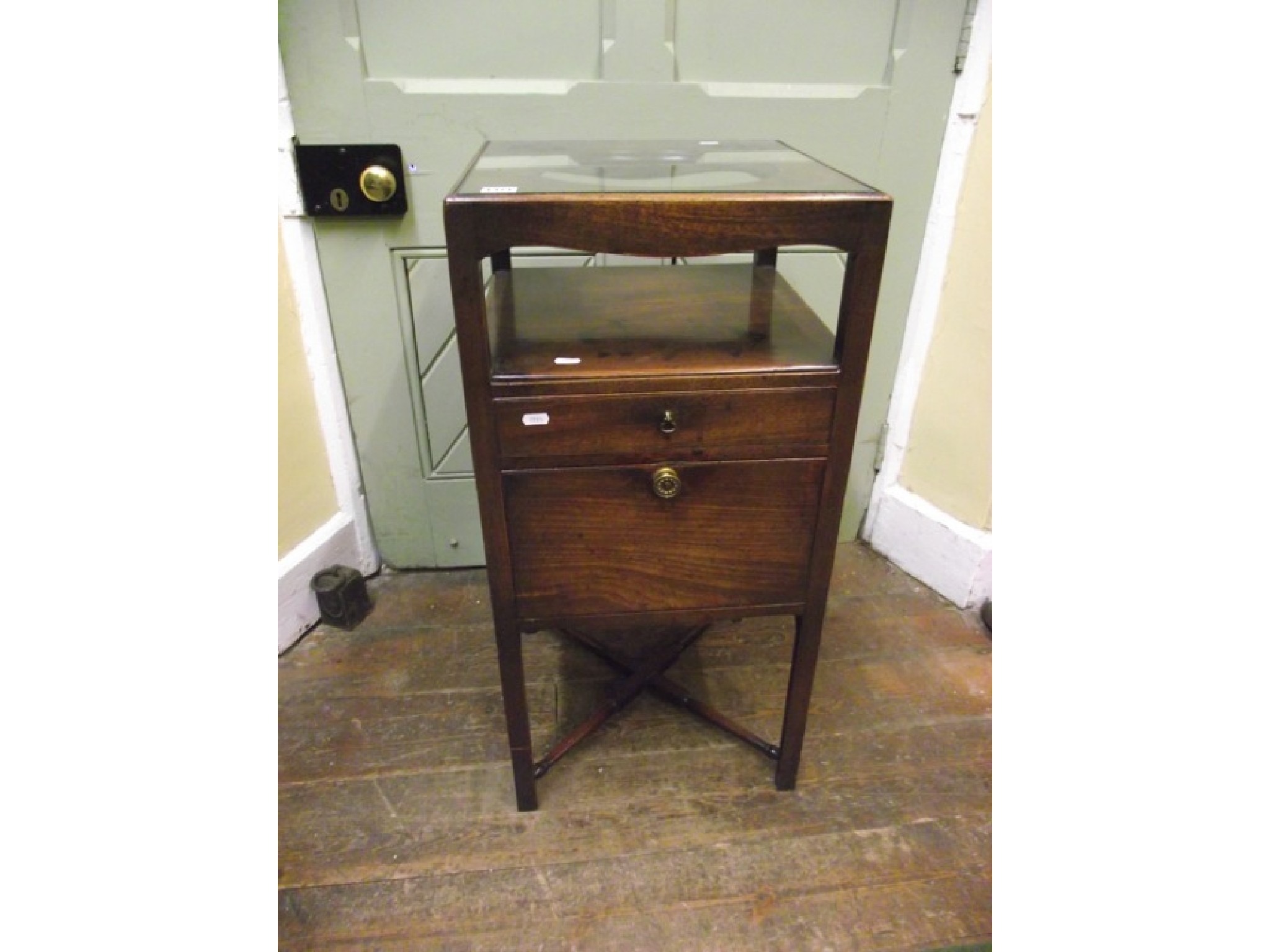 Appraisal: A Georgian mahogany washstand of square cut form the front