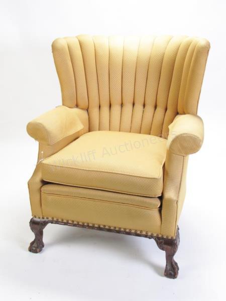 Appraisal: A vintage 's channel-back arm chair gold upholstery ball and