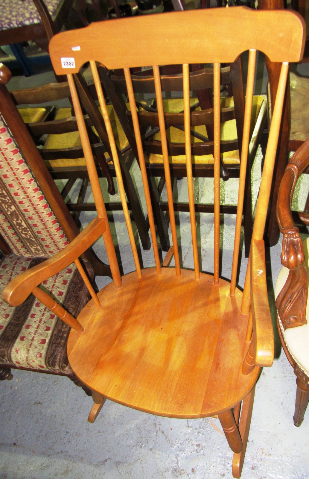 Appraisal: A th century beech stick back rocking chair