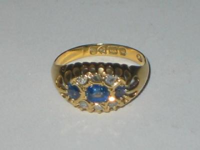 Appraisal: A SAPPHIRE AND DIAMOND RING comprising three sapphires set in