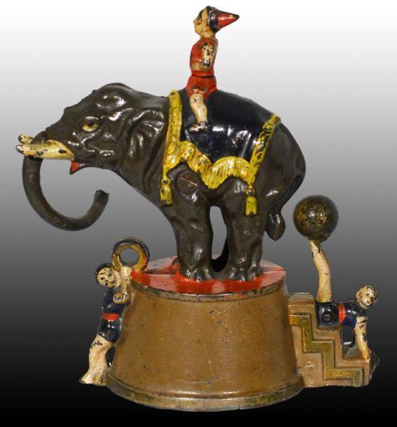 Appraisal: Cast Iron Elephant Three Clowns Mechanical Bank Description Manufactured by