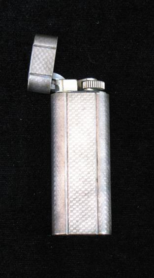 Appraisal: CARTIER A CIGARETTE LIGHTER with engine-turned decoration inscribed Cartier Paris