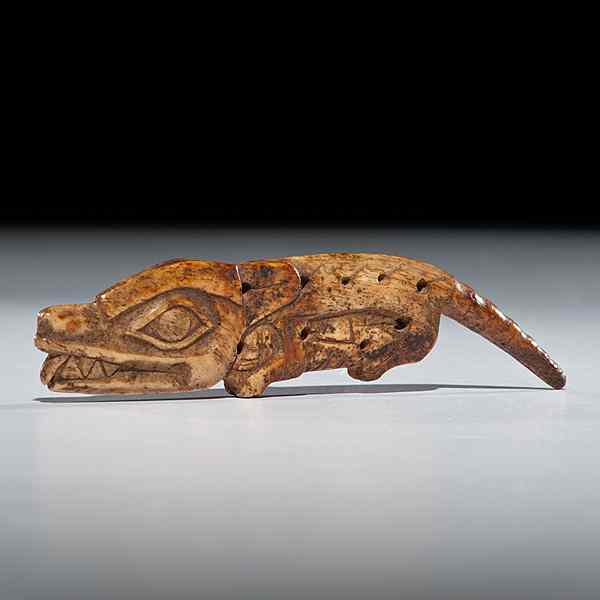 Appraisal: Tlingit Bone Amulet transforming figure showing characteristics of multiple animals