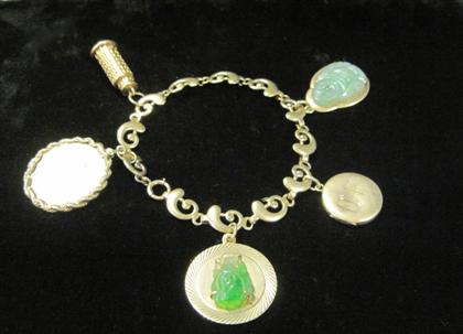 Appraisal: karat yellow gold charm braceletFive assorted charms including two jade