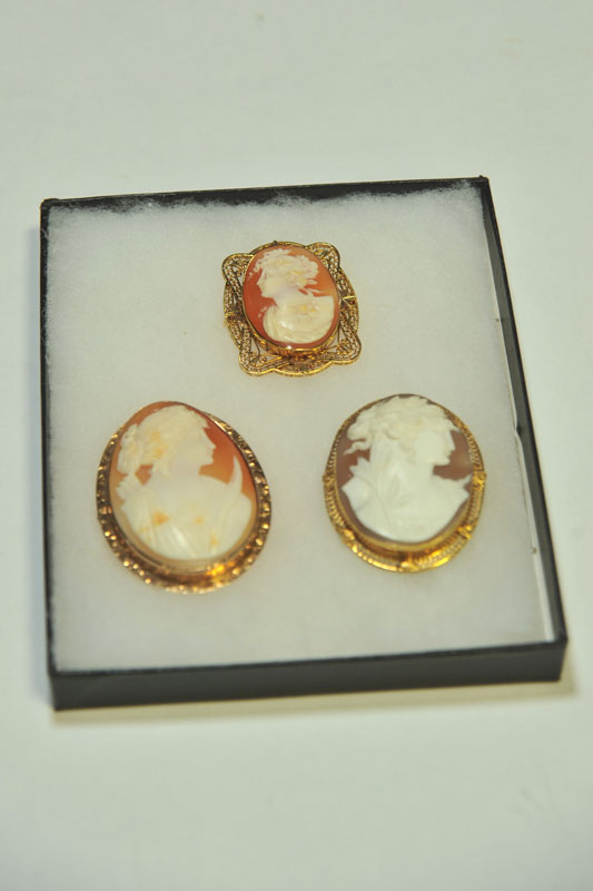 Appraisal: THREE CAMEOS All Victorian carved shell cameos in marked ''