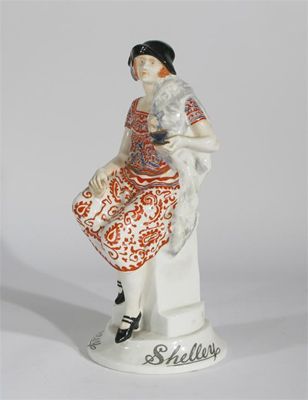 Appraisal: Shelley Girl' a rare Shelley Pottery advertising figure modelled seated