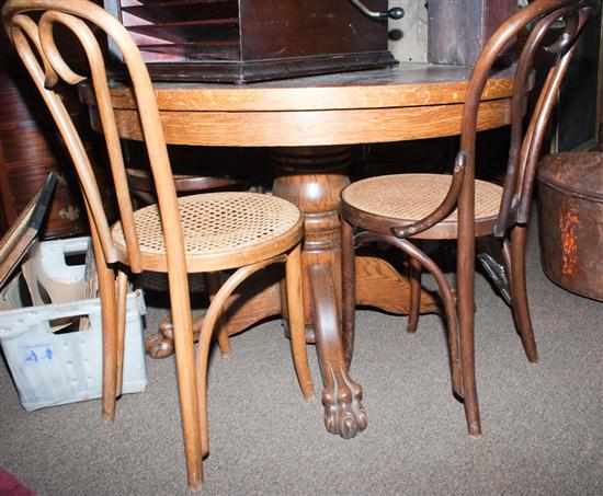 Appraisal: Victorian oak circular-form table together with four oak bentwood cane