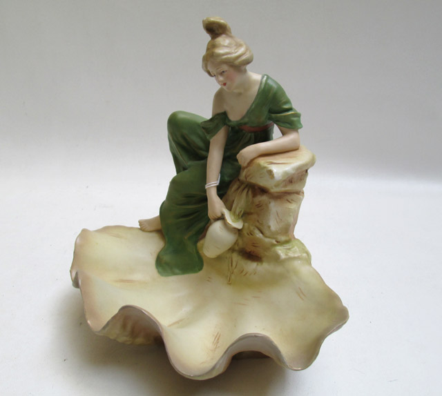 Appraisal: ROYAL DUX POTTERY FIGURAL BOWL having a young woman filling