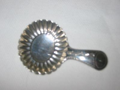 Appraisal: A GEORGE III CADDY SPOON with oval shell bowl lug