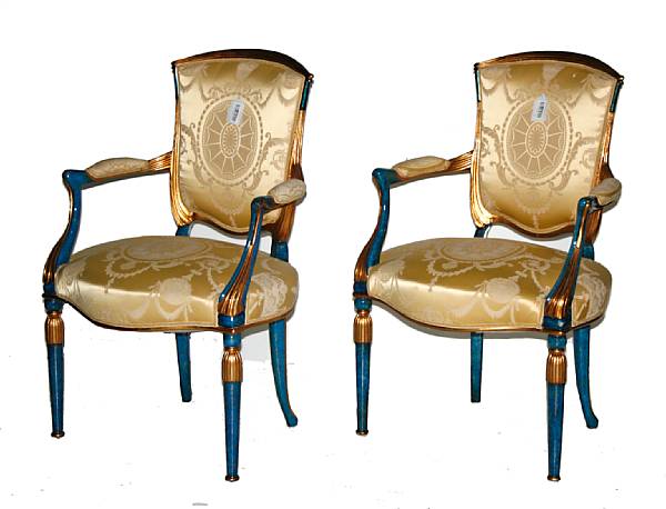 Appraisal: A pair of Neoclassical style painted parcel gilt upholstered fauteuils