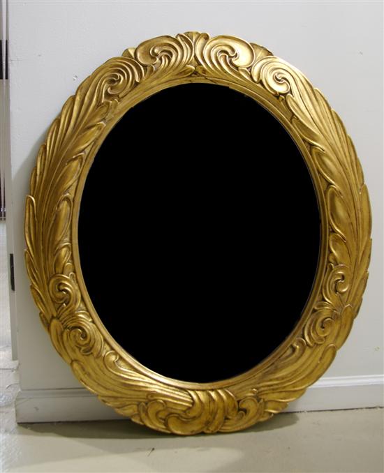 Appraisal: An Oval Giltwood Mirror the Newcomb Macklin Company Height x