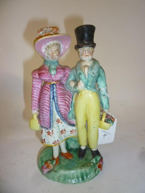 Appraisal: A PEARLWARE FIGURE GROUP early th century Dandies modelled as