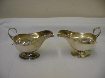 Appraisal: A PAIR OF SAUCE BOATS of oval form with moulded