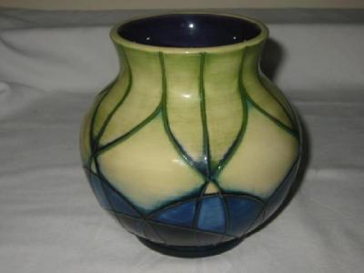 Appraisal: A MOORCROFT POTTERY VASE of bellied form tube lined with