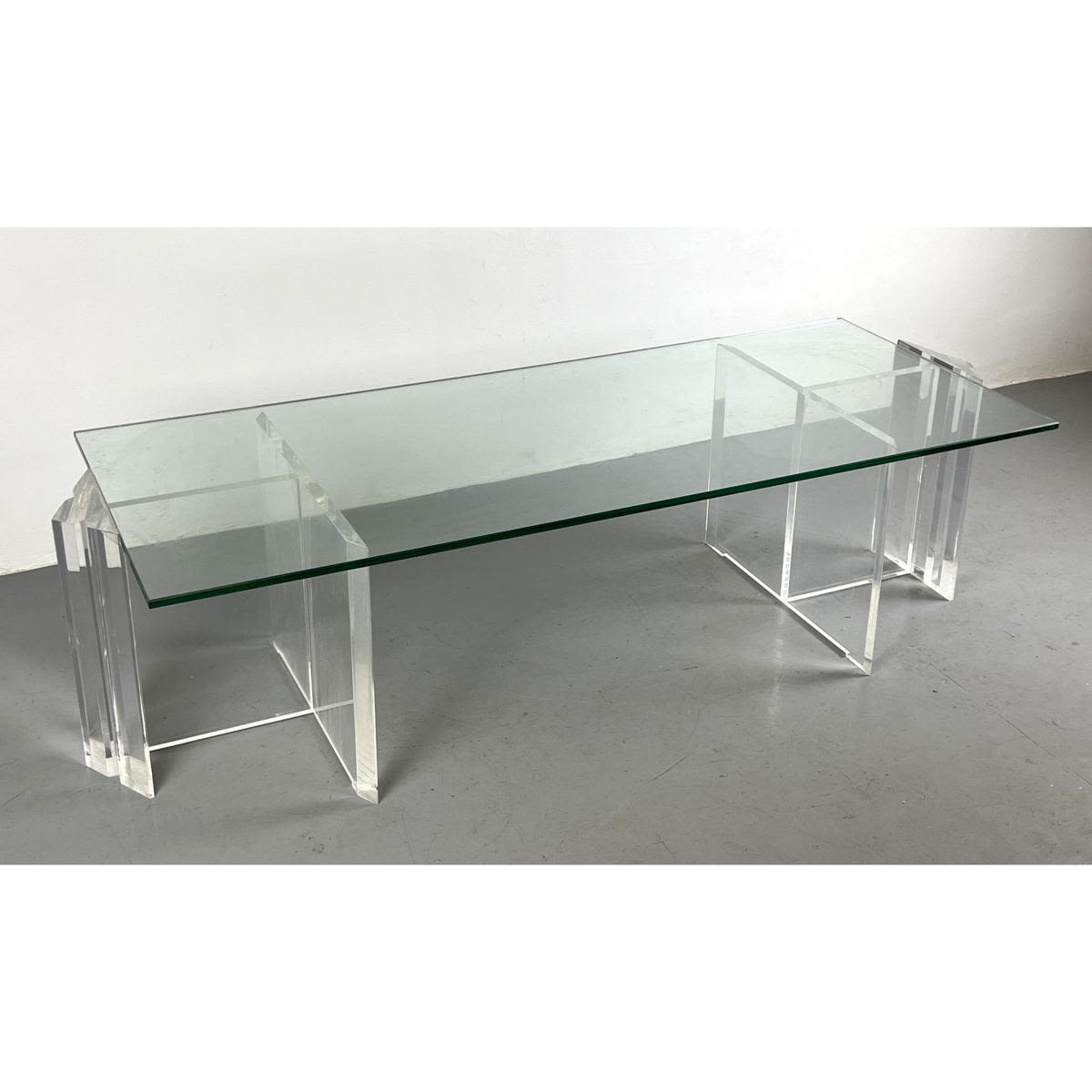 Appraisal: Vintage Lucite coffee table with triangle ends Two piece base