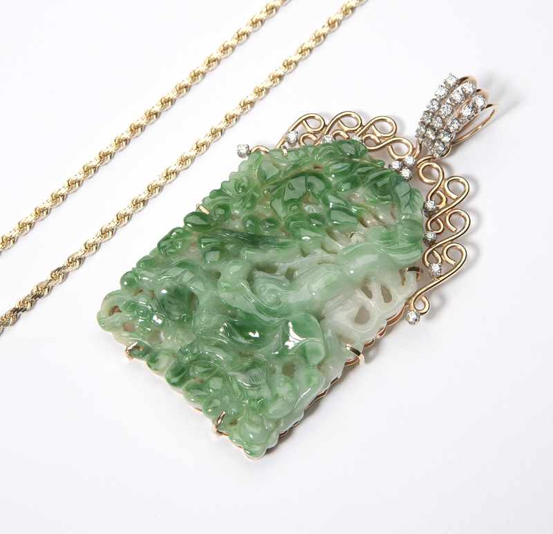 Appraisal: The large green and white pendant within a K gold