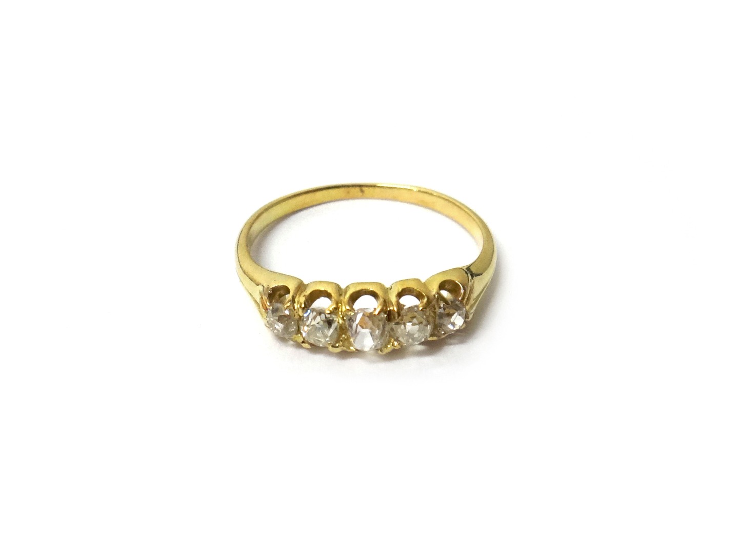 Appraisal: A gold and diamond set five stone ring mounted with