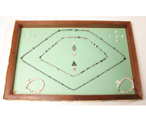 Appraisal: Frame of shell glass and gold Indian and trade beads