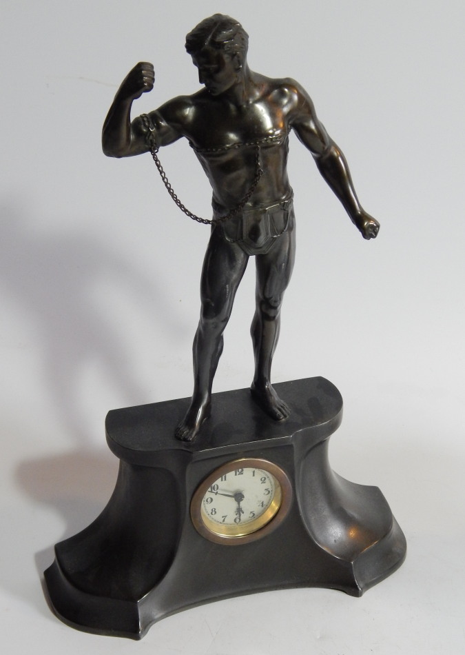 Appraisal: An early thC patinated spelter mantel clock the shaped case