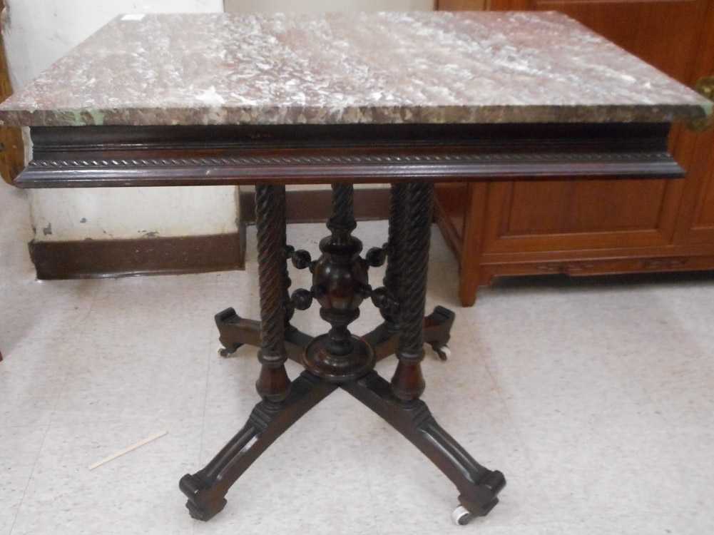 Appraisal: A VICTORIAN MARBLE-TOP WALNUT LAMP TABLE Eastlake style American c