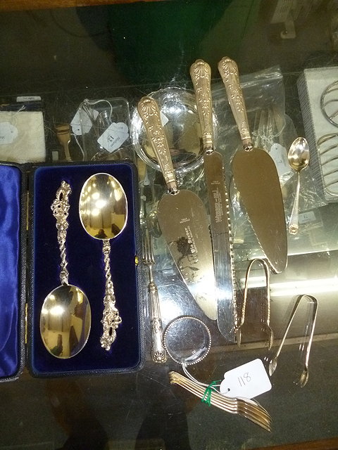 Appraisal: A PAIR OF CASED SILVER SPOONS with cast handles together