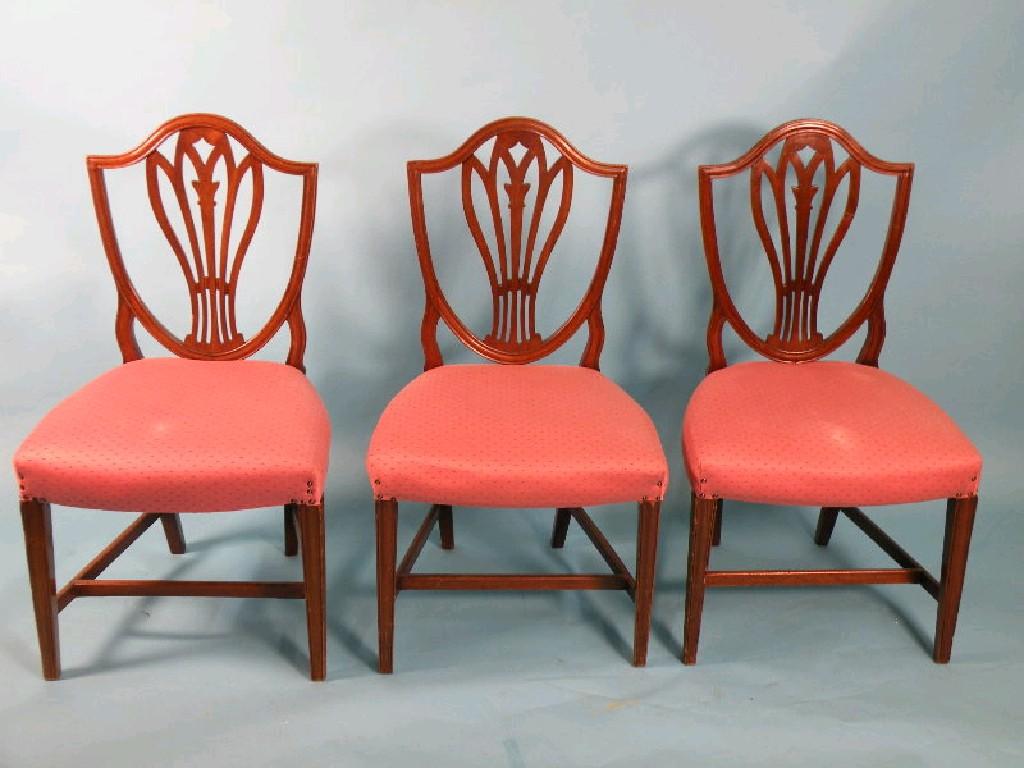 Appraisal: A set of three mahogany dining chairs in George III