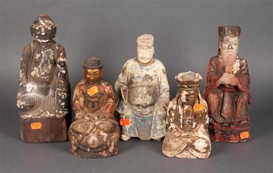 Appraisal: Four Chinese carved and painted wood seated figures and a