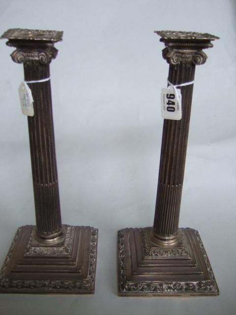 Appraisal: A pair of George III silver table candlesticks each of