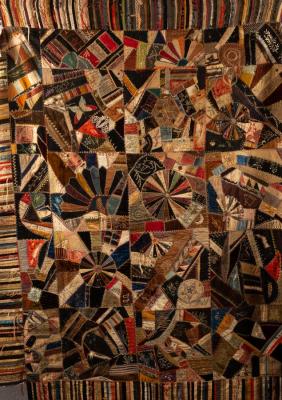 Appraisal: A late th Century American patchwork quilt of velvet satin