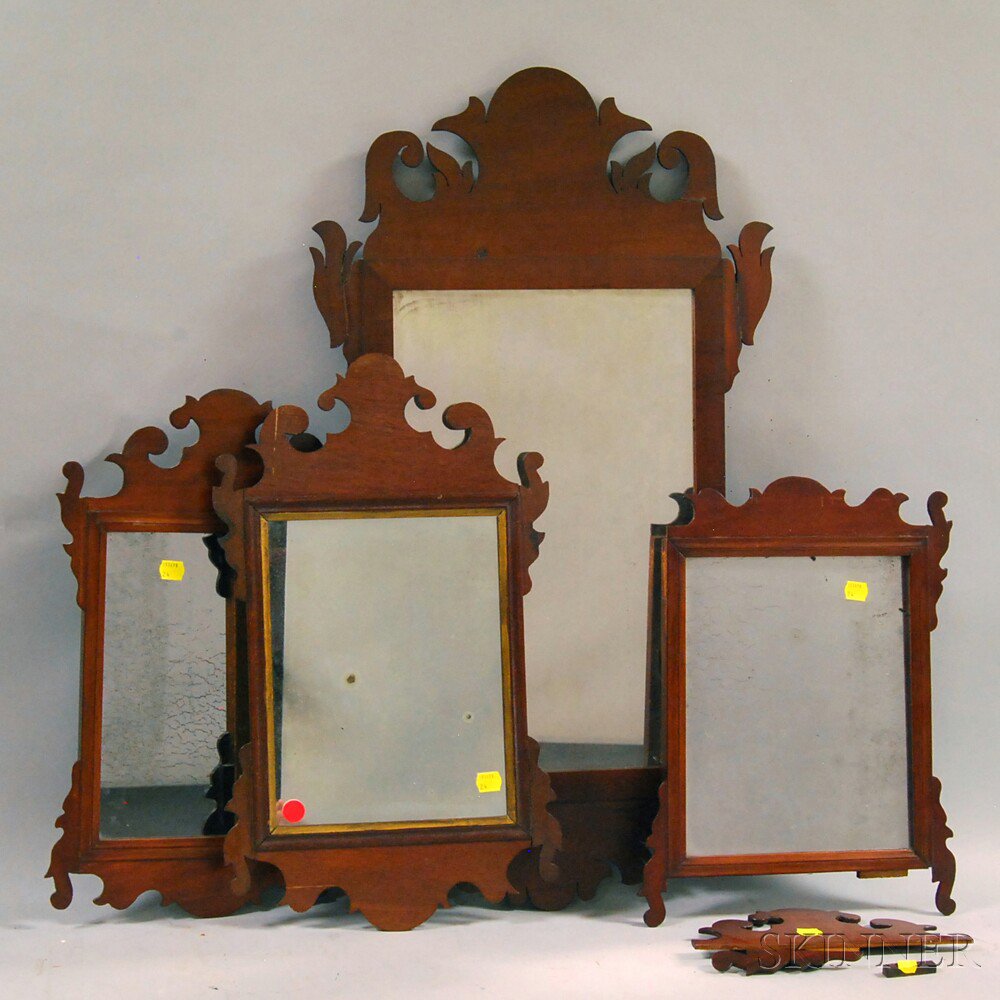 Appraisal: Four Small Chippendale-style Mahogany Scroll-frame Mirrors damage lg to wd