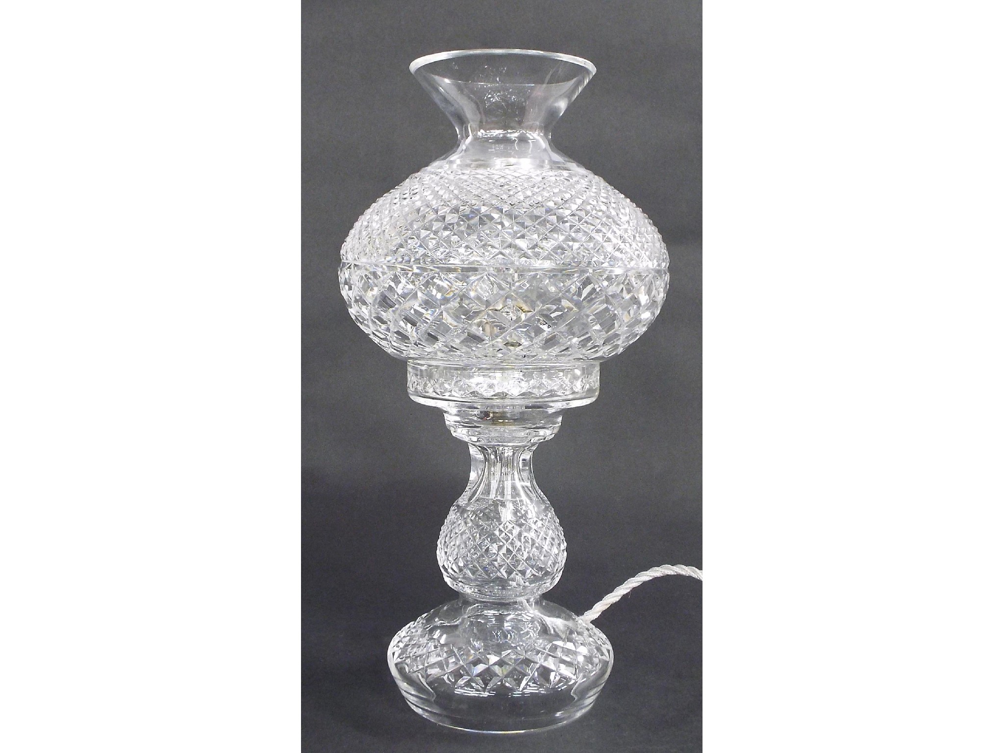 Appraisal: Crystal cut glass table lamp with ovoid shade upon a