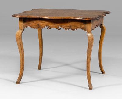 Appraisal: French Provincial oak table cartouche-shaped top on scrolled skirt and