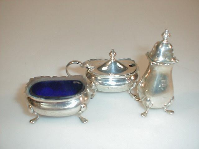 Appraisal: A silver three-piece cruet by Walker Hall Birmingham assay