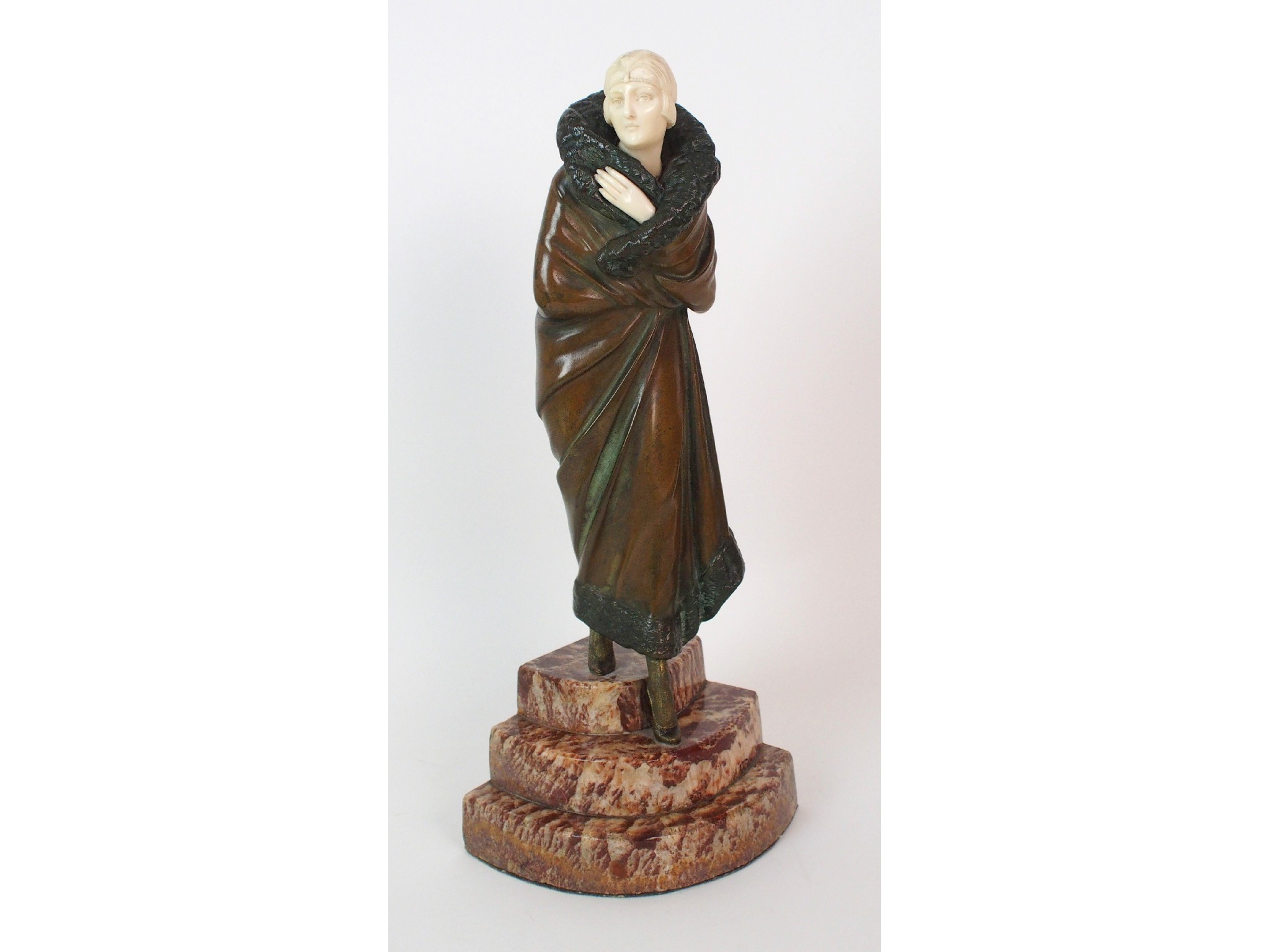 Appraisal: An Art Deco patinated bronze and ivory figure by Demetre