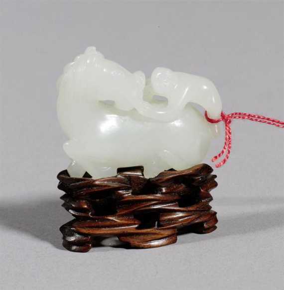 Appraisal: A LIGHT SELADON JADE CARVING OF A RECUMBENT HORSE WITH