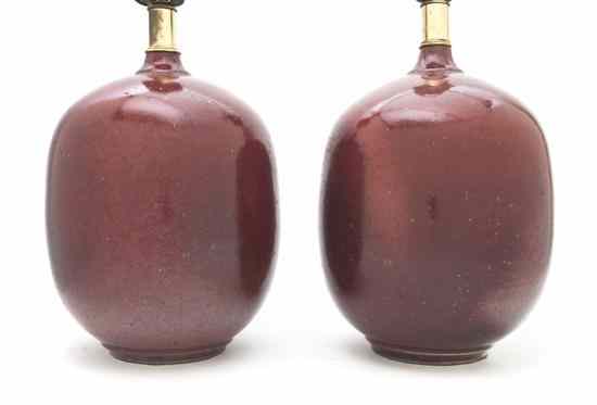 Appraisal: A Pair of Sang de Boeuf Glazed Vases of ovoid