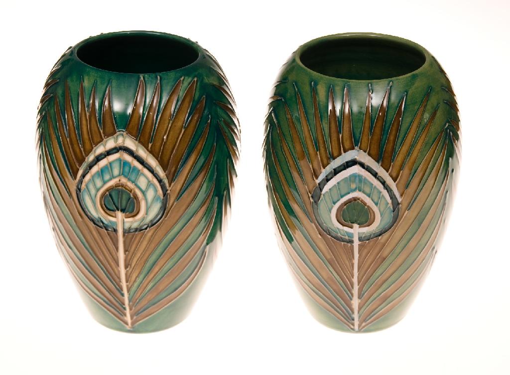 Appraisal: PAIR OF WALTER MOORCROFT POTTERY VASES tubelined and hand-painted in