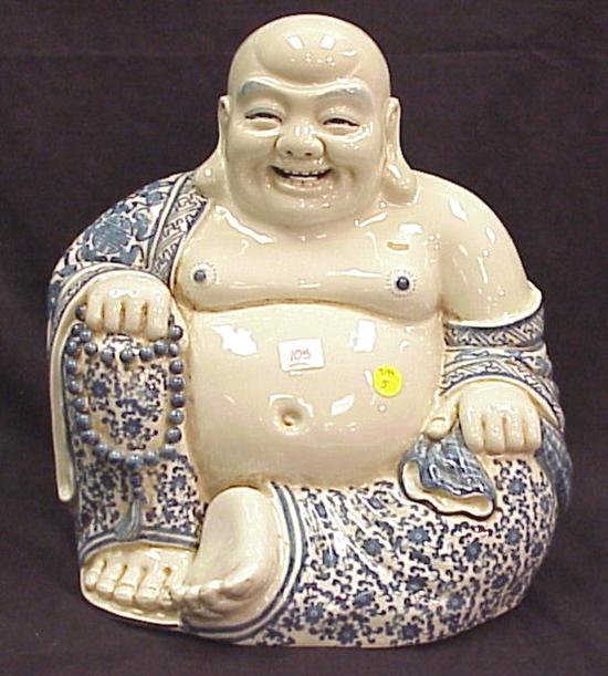 Appraisal: Porcelain figure of Buddha th C depicted seated and wearing