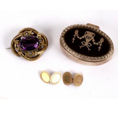 Appraisal: A Victorian amethyst brooch in gilt metal scroll frame mm