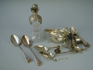 Appraisal: A silver mounted decanter of hour glass form with spiral