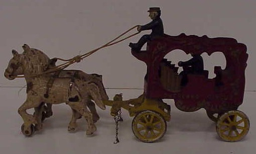 Appraisal: Cast iron Overland Circus wagon and two horses loss of