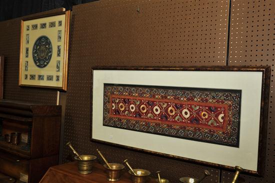 Appraisal: TWO FRAMED TEXTILES Asian th century Intricately embroidered panel in