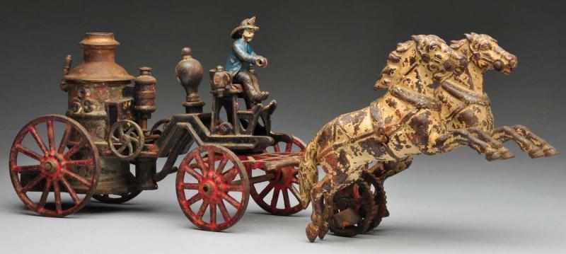 Appraisal: Cast Iron Carpenter Fire Pumper Horse-Drawn Toy Description American No