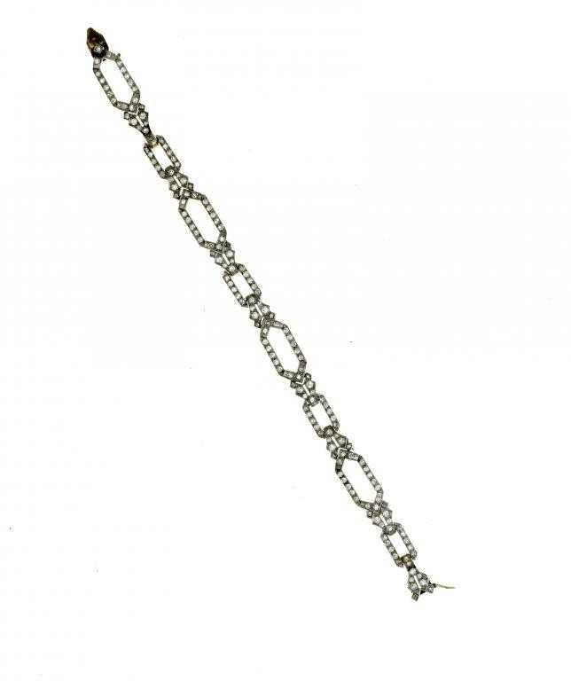 Appraisal: AN ART DECO DIAMOND BRACELET of longer hexagonal and shorter