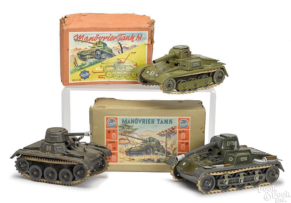 Appraisal: Three tin lithograph clockwork German tanks Three tin lithograph clockwork