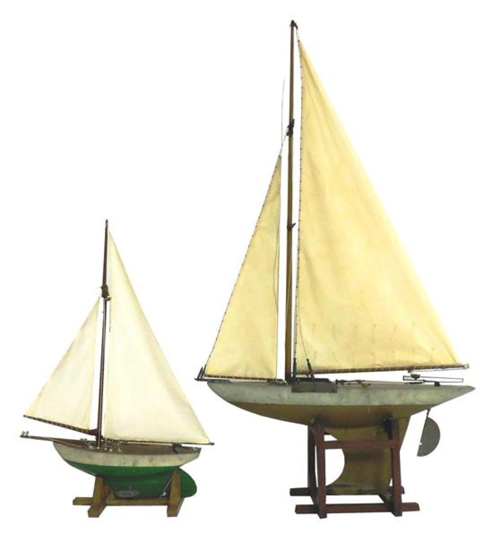 Appraisal: Two wooden pond sailers with metal keels on removable stands