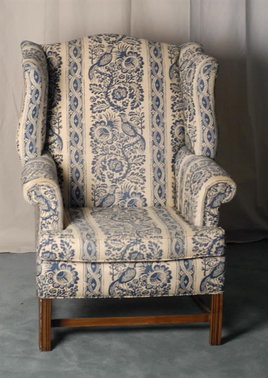 Appraisal: A Large Wingback Chair with deep wings rolled arms and